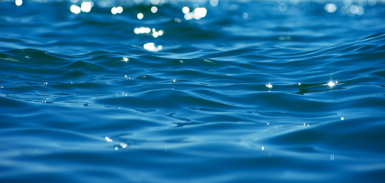 A closeup of glistening, rippled sea water