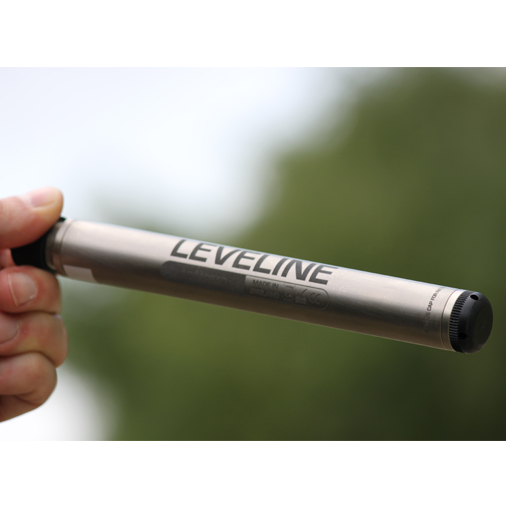 A person holds up the Aquaread Leveline Water Level Sensor against a blurred background.