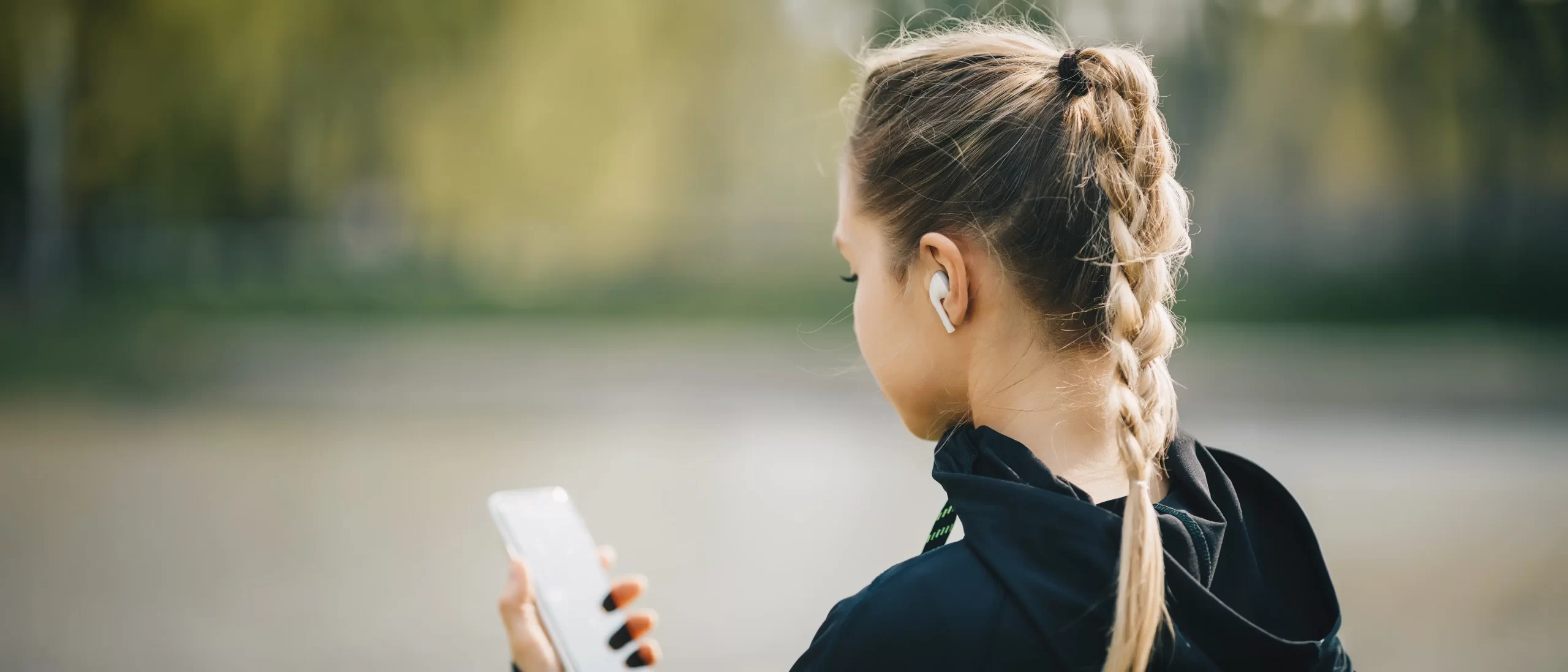 A person outside making a call on their phone.